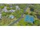 Aerial view of the community's pool and tennis courts surrounded by green landscaping at 515 Spring Lakes Blvd # 515, Bradenton, FL 34210