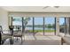 Bright dining area with waterfront views through sliding glass doors, allowing abundant natural light to fill the space at 515 Spring Lakes Blvd # 515, Bradenton, FL 34210