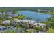 Charming condo exterior with palm trees, well-maintained landscaping, and a serene lakeside setting at 515 Spring Lakes Blvd # 515, Bradenton, FL 34210