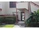 Up close exterior of condo with manicured lawn and private entrance at 515 Spring Lakes Blvd # 515, Bradenton, FL 34210