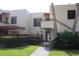 Condominium building with well-maintained landscaping and walkway leading to the entrance, creating a welcoming curb appeal at 515 Spring Lakes Blvd # 515, Bradenton, FL 34210