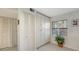 Well-organized hallway with ample storage cabinets and a window, offering practical space and natural light at 515 Spring Lakes Blvd # 515, Bradenton, FL 34210