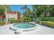 The community hot tub is surrounded by lush landscaping in a secure area at 515 Spring Lakes Blvd # 515, Bradenton, FL 34210