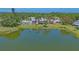 Amazing lakeside condo view from the water with large sliding glass doors and palm trees at 515 Spring Lakes Blvd # 515, Bradenton, FL 34210