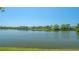 Scenic view of a tranquil lake and surrounding condos, perfect for relaxing lakeside living at 515 Spring Lakes Blvd # 515, Bradenton, FL 34210