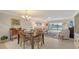 Open-concept living room with view of community lake at 515 Spring Lakes Blvd # 515, Bradenton, FL 34210