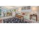 Comfortable living room with area rug and seamless flow into the dining area at 515 Spring Lakes Blvd # 515, Bradenton, FL 34210