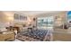 Comfortable living room with sliding glass doors to the terrace at 515 Spring Lakes Blvd # 515, Bradenton, FL 34210