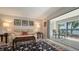 Serene living room with sliding doors to patio and lake views at 515 Spring Lakes Blvd # 515, Bradenton, FL 34210