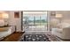 Inviting living room with access to a screened lanai offering picturesque views of the tranquil lake at 515 Spring Lakes Blvd # 515, Bradenton, FL 34210