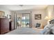 Comfortable main bedroom offers private access to the sun room, with serene views of the lake at 515 Spring Lakes Blvd # 515, Bradenton, FL 34210