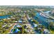 Aerial view of neighborhood community that features water views and lush green trees at 5247 Carmilfra Dr, Sarasota, FL 34231