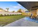 Landscaped backyard with a patio area and outdoor seating at 5247 Carmilfra Dr, Sarasota, FL 34231