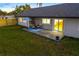 Backyard view with a patio, outdoor seating and dining set on an outside concrete porch at 5247 Carmilfra Dr, Sarasota, FL 34231