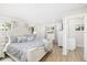Bright bedroom featuring stylish bedding, natural light, and a soothing color palette, offering a serene atmosphere at 5247 Carmilfra Dr, Sarasota, FL 34231