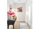 Bright foyer with modern decor, a stylish mirror, and decorative accents creating a welcoming entrance at 5247 Carmilfra Dr, Sarasota, FL 34231