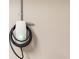 Close up of a home EV charger installed on the wall in a garage at 5247 Carmilfra Dr, Sarasota, FL 34231