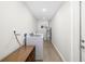 Functional laundry room with a washer, dryer, and storage space at 5247 Carmilfra Dr, Sarasota, FL 34231