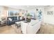 Bright living room featuring modern sofas, large windows, and stylish decor, creating a cozy atmosphere at 5247 Carmilfra Dr, Sarasota, FL 34231
