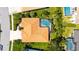 Aerial view of home featuring a screened-in pool, manicured landscaping, and an orange roof at 5270 Far Oak Cir, Sarasota, FL 34238