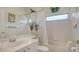 Well-lit bathroom with a tub, shower, mirrored wall and modern fixtures at 5270 Far Oak Cir, Sarasota, FL 34238