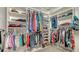 Organized walk-in closet with ample storage space for clothes, shoes, and accessories at 5270 Far Oak Cir, Sarasota, FL 34238