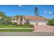 Beautiful pink single-story home featuring a three-car garage and a well-manicured front lawn at 5270 Far Oak Cir, Sarasota, FL 34238