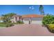 Lovely single-story home featuring a three-car garage and a brick paver driveway at 5270 Far Oak Cir, Sarasota, FL 34238