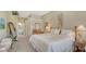 Spacious bedroom with neutral walls, carpet, and view to en-suite bathroom at 5270 Far Oak Cir, Sarasota, FL 34238