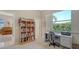 Bright office featuring a desk, bookcase, and a view to the outdoors at 5270 Far Oak Cir, Sarasota, FL 34238