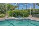 Pool features an integrated hot tub spa with lush surrounding greenery for privacy and relaxation at 5270 Far Oak Cir, Sarasota, FL 34238