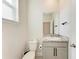 Clean, simple powder room with granite vanity and modern fixtures at 5336 Grove Mill Loop, Lakewood Ranch, FL 34211