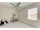 Bedroom with ceiling fan and window, creating a calm and inviting atmosphere at 5336 Grove Mill Loop, Lakewood Ranch, FL 34211