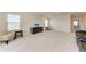 Expansive bonus room for relaxing featuring comfortable seating and bright windows at 5336 Grove Mill Loop, Lakewood Ranch, FL 34211