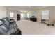 The bonus room offers abundant space and natural light from multiple windows at 5336 Grove Mill Loop, Lakewood Ranch, FL 34211
