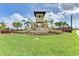 Beautiful community entrance with lush landscaping and elegant signage at 5336 Grove Mill Loop, Lakewood Ranch, FL 34211