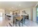 Dining room with slider to the backyard and an open view of the kitchen at 5336 Grove Mill Loop, Lakewood Ranch, FL 34211