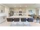 Stylish kitchen features a large center island with seating, stainless steel appliances, and modern cabinetry at 5336 Grove Mill Loop, Lakewood Ranch, FL 34211