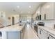 Modern kitchen features gray cabinets, granite countertops, and stainless steel appliances at 5336 Grove Mill Loop, Lakewood Ranch, FL 34211