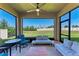 Relaxing lanai with comfortable seating and a picturesque backyard view at 5336 Grove Mill Loop, Lakewood Ranch, FL 34211