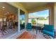Inviting lanai with indoor-outdoor flow, perfect for dining and relaxation at 5336 Grove Mill Loop, Lakewood Ranch, FL 34211