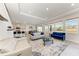 Spacious living area with modern furniture, plenty of natural light, and open-concept design at 5336 Grove Mill Loop, Lakewood Ranch, FL 34211