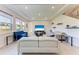 Spacious living room with tile flooring, recessed lighting, and a view of the backyard at 5336 Grove Mill Loop, Lakewood Ranch, FL 34211