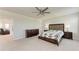 Spacious main bedroom features a ceiling fan and abundant natural light at 5336 Grove Mill Loop, Lakewood Ranch, FL 34211
