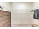 This walk-in closet offers ample storage space and custom shelving at 5336 Grove Mill Loop, Lakewood Ranch, FL 34211