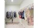 Walk-in closet features plenty of hanging storage for clothes and accessories at 5336 Grove Mill Loop, Lakewood Ranch, FL 34211
