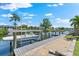 Scenic waterfront property featuring a private boat lift, and beautiful water access at 5563 America Dr, Sarasota, FL 34231