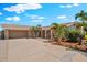 Charming single-story home featuring a wide driveway, lush landscaping and a two car garage at 5563 America Dr, Sarasota, FL 34231