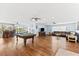 Spacious living room with hardwood floors and comfortable leather furniture, creating a relaxing atmosphere at 5563 America Dr, Sarasota, FL 34231