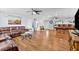 Spacious living room with hardwood floors, ample seating, and an open layout at 5563 America Dr, Sarasota, FL 34231